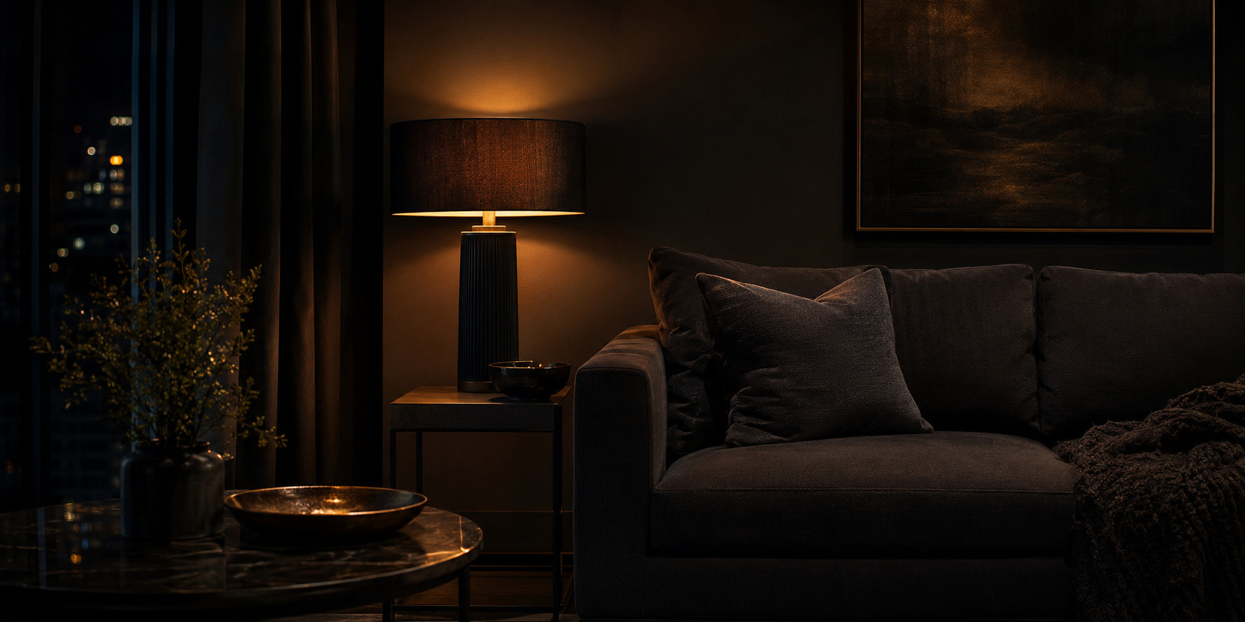 Dark lounge lit by a single warm lamp